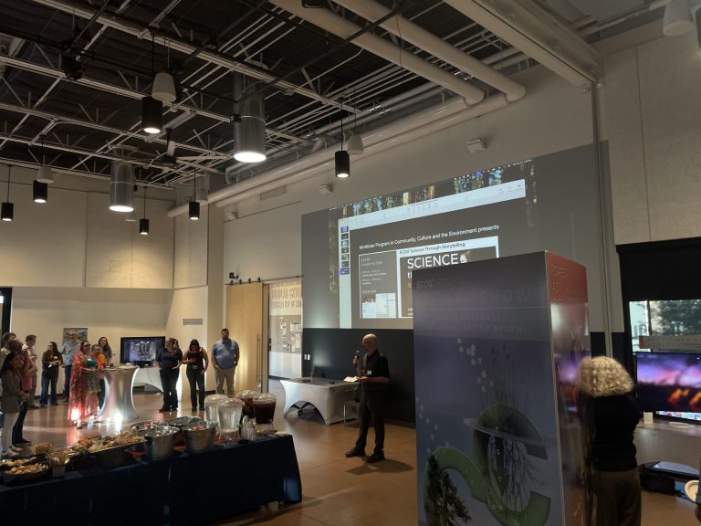 The Pavilion floor during the show: guests among the art stations, the buffet in front