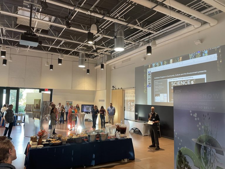 The Pavilion floor with the show title on the big screen