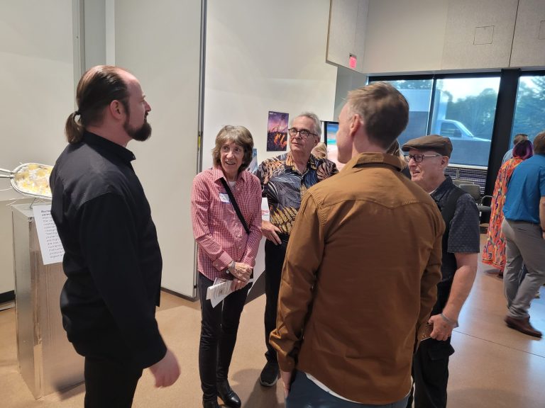 Victor talking with guests